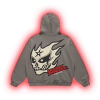 A gray pullover hoodie shown from the back, featuring a large graphic of a skull in a lucha-style mask with flames, the text 'ZORO MIEDO', and 'FENTA' in red and black. The hoodie is centered on a white background with a red glow effect around it.