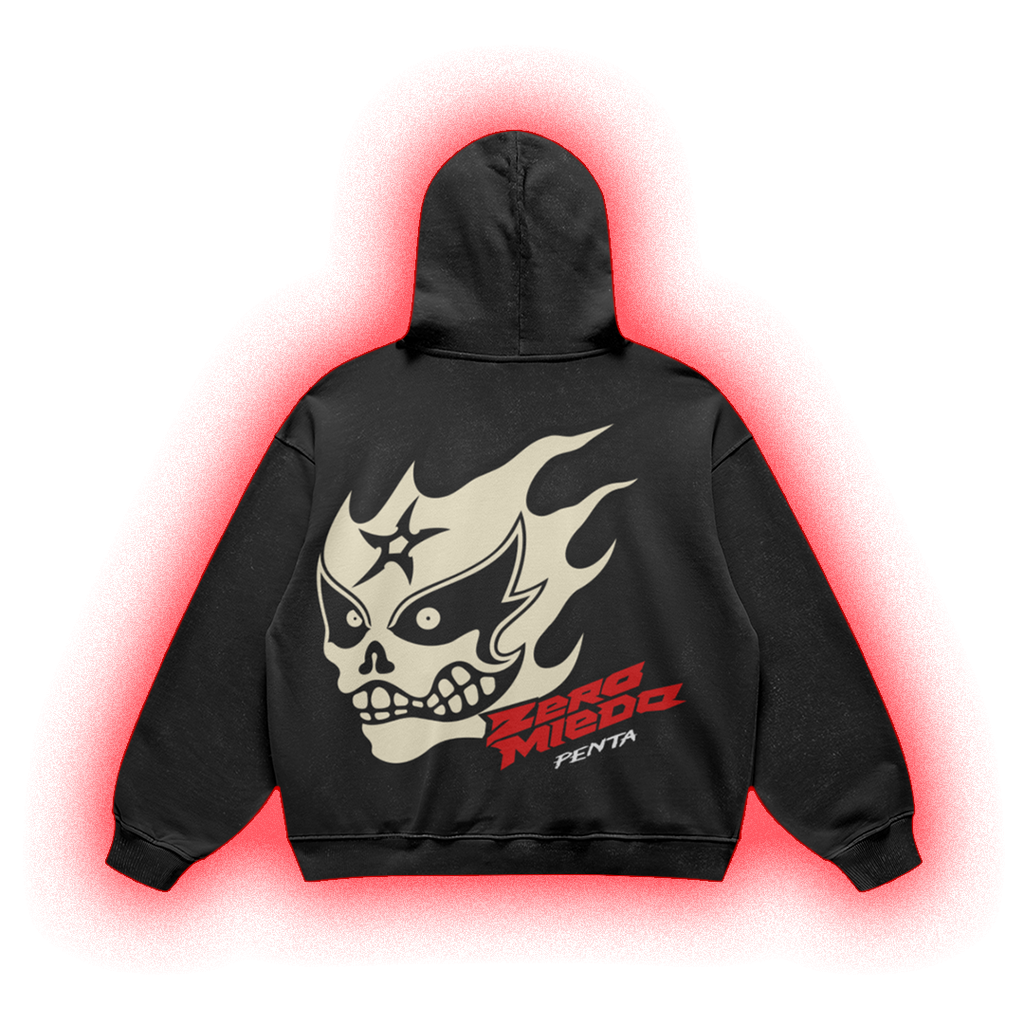 A black pullover hoodie shown from the back, featuring a large cream skull-and-flame graphic with red and white 'Zerg Miedo' text, isolated on a black background with a red glow effect.