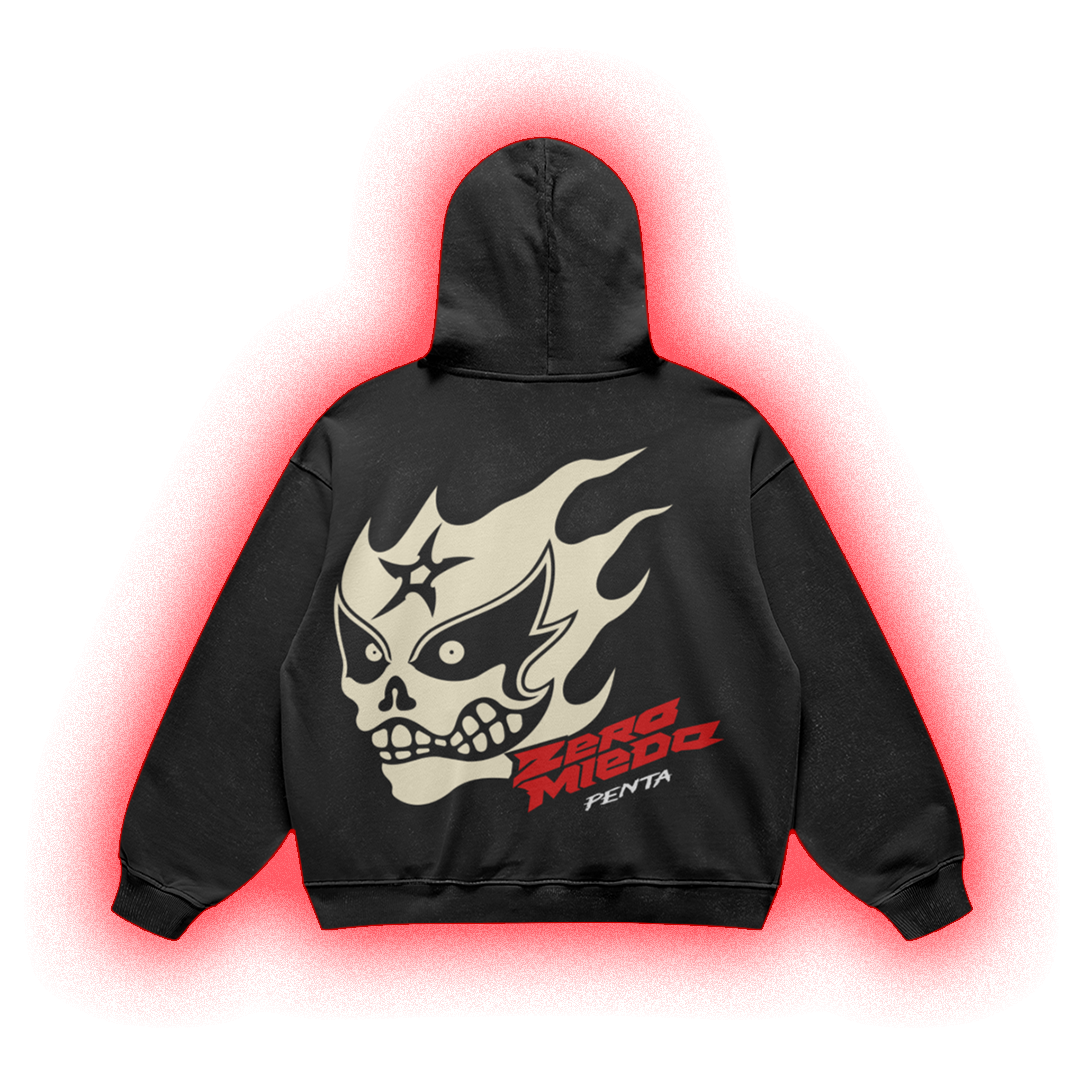 A black pullover hoodie shown from the back, featuring a large cream skull-and-flame graphic with red and white 'Zerg Miedo' text, isolated on a black background with a red glow effect.